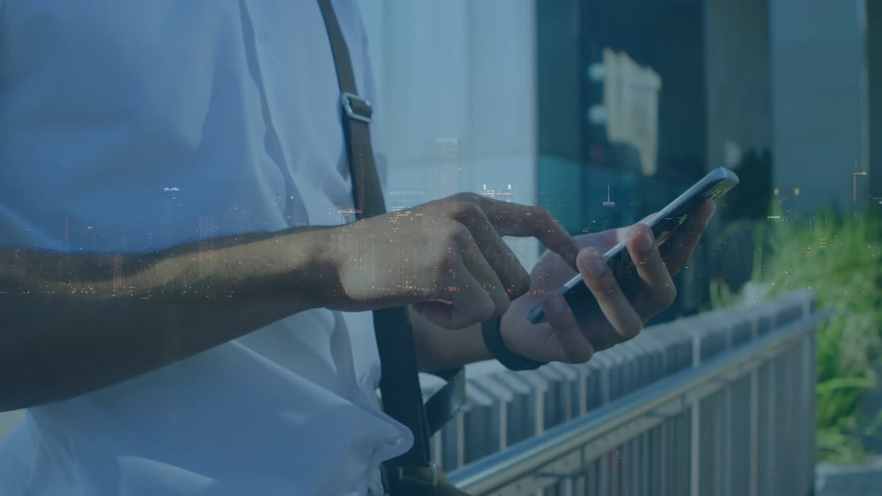 Animation of man using smartphone over cityscape