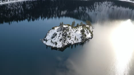 a frozen fannette island in emerald bay lake tahoe glitters in the late afternoon sunlight