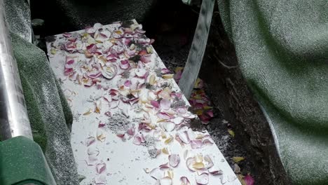 closeup shot of a funeral casket in a hearse or chapel or burial at cemetery