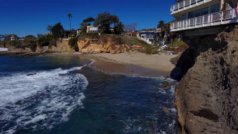 aerial drone view of fishermans cove and the coast in laguna beach, california