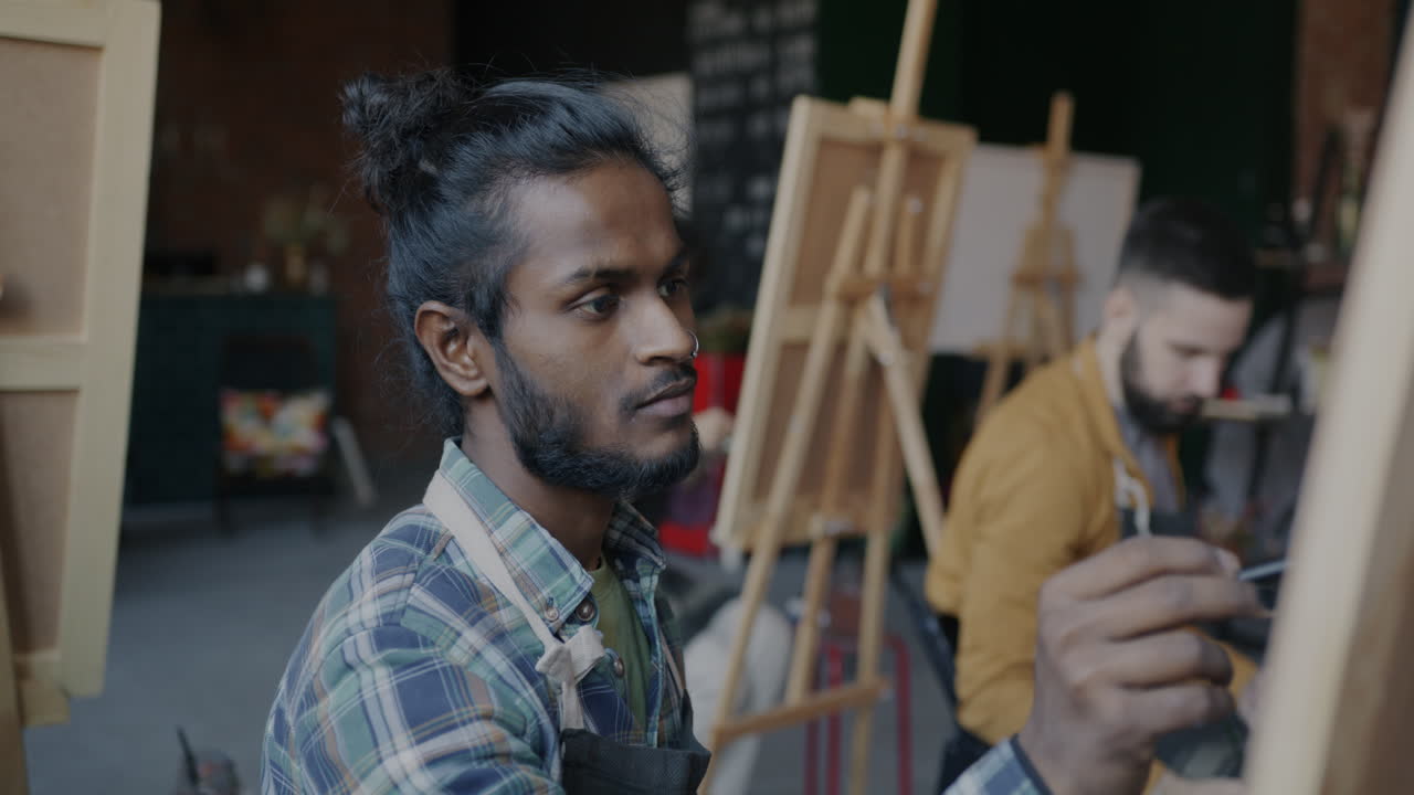Students painting in an art studio