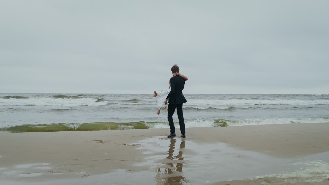 Wedding couple celebrating on the beach