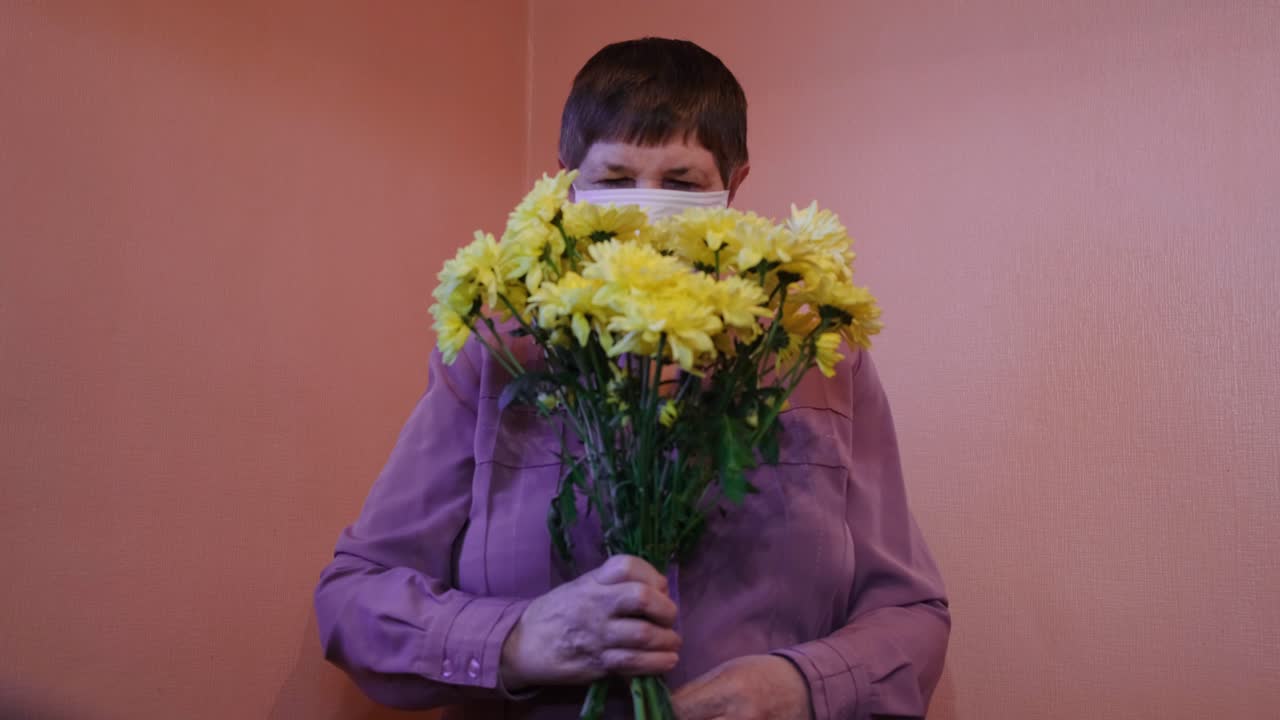 Woman Receiving a Bouquet of Yellow Chrysanthemums