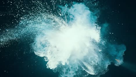 a white cloud shaped like an explosion against a dark blue background