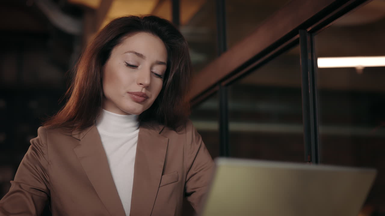 Businesswoman blowing nose in the office