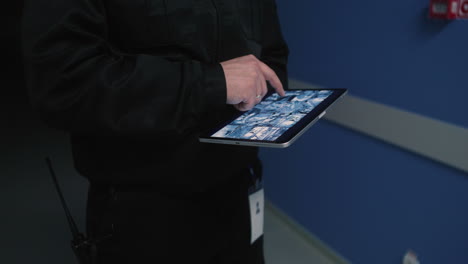 caucasian man using tablet at night