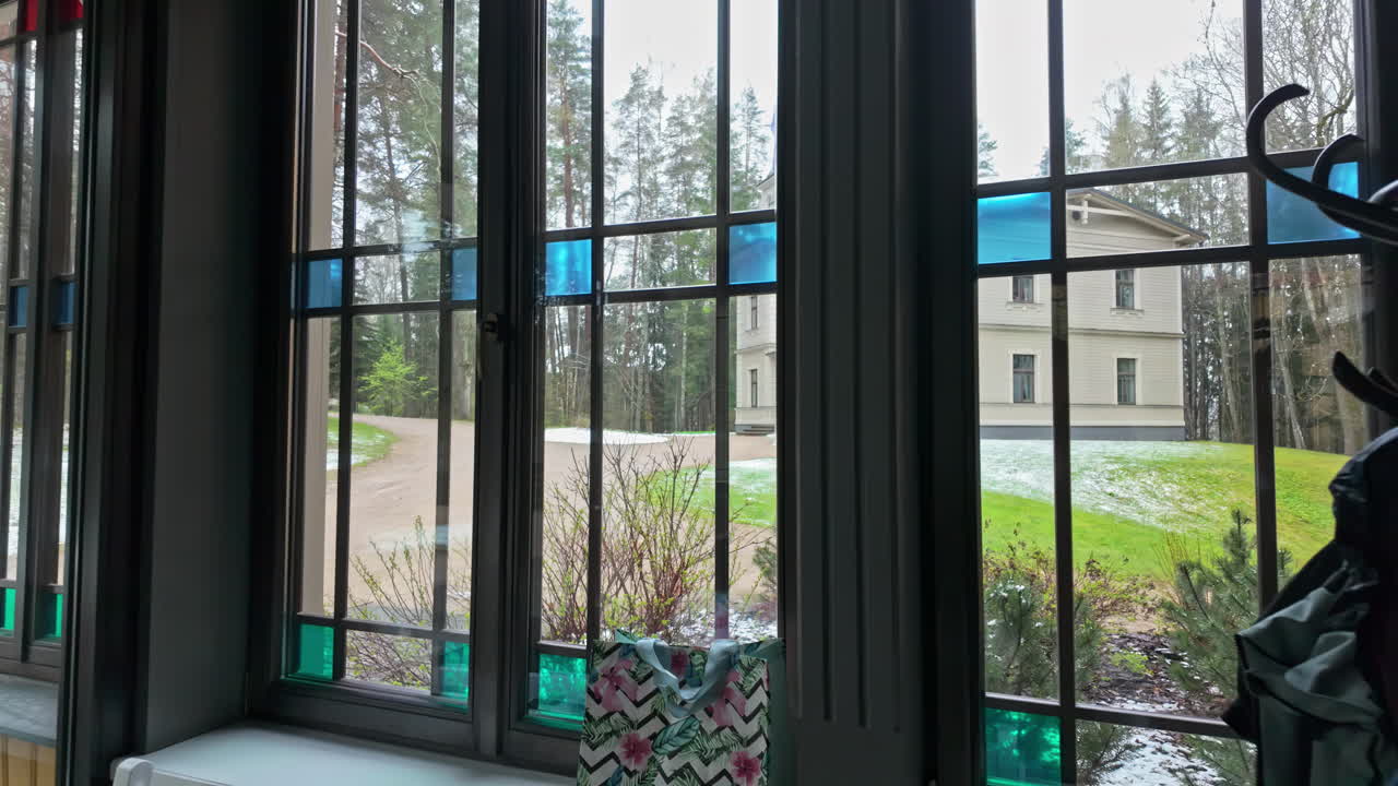 View from the window of garden and nature near forest, light snow on the ground