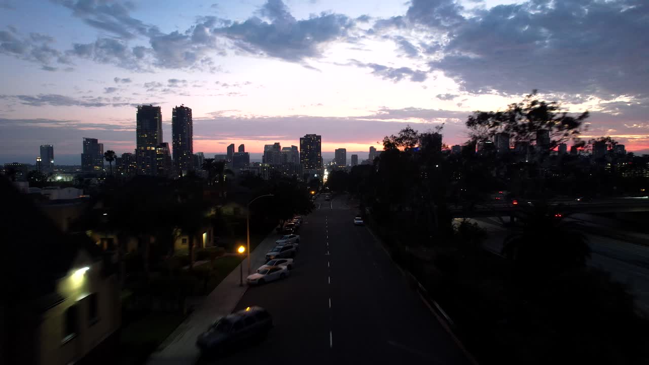 San Diego Sky line at Sunset June 2 2021 orange and red sky 4k Mavic air 2S Palm trees. Sunset was at 8:01pm and this clip was filming shortly after.