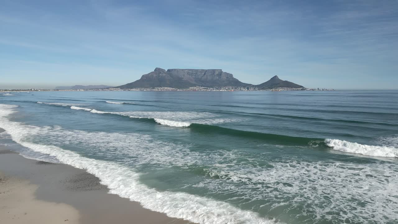 Drone shot flying over Blouberg Beach and approaching Table Mountain, Africa