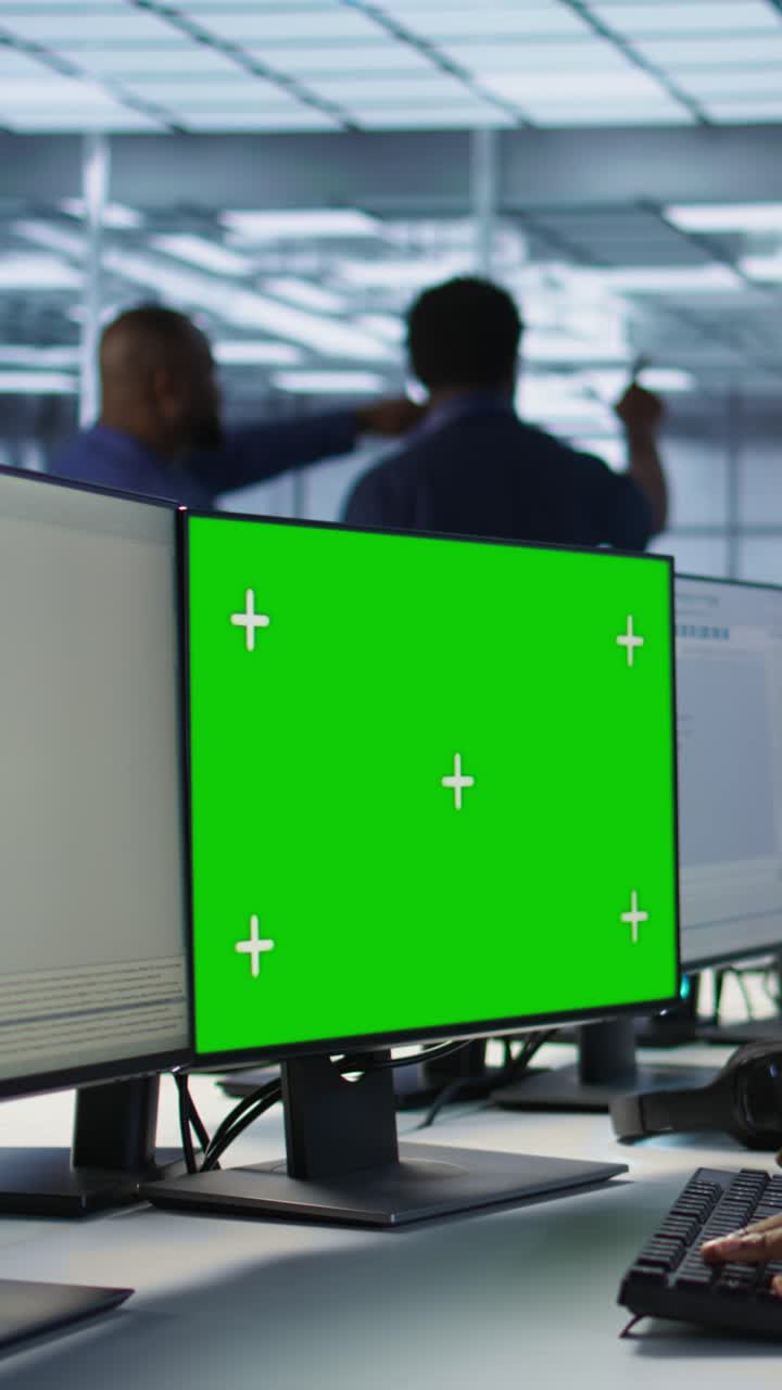 Vertical video IT professional coding on chroma key PC in data center