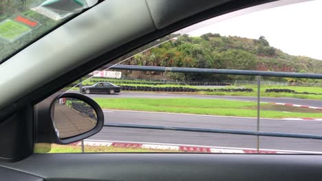 Watching-a-drifter-form-inside-a-car-make-that-U-turn-during-a-race-in-Faial,-Portugal