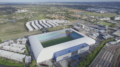 view from above of the robina football stadium with nearby houses in queensland, australia