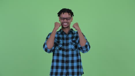 happy young handsome african hipster man with dreadlocks
