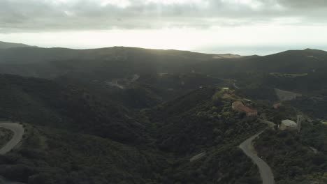 Aerial-of-mediterrenean-empty-landscape-with-an-scary-thrilling-mood-and-few-houses-in-the-mountains-of-sardinia