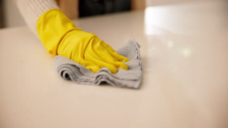 Woman-in-headphones-in-kitchen-cleaning