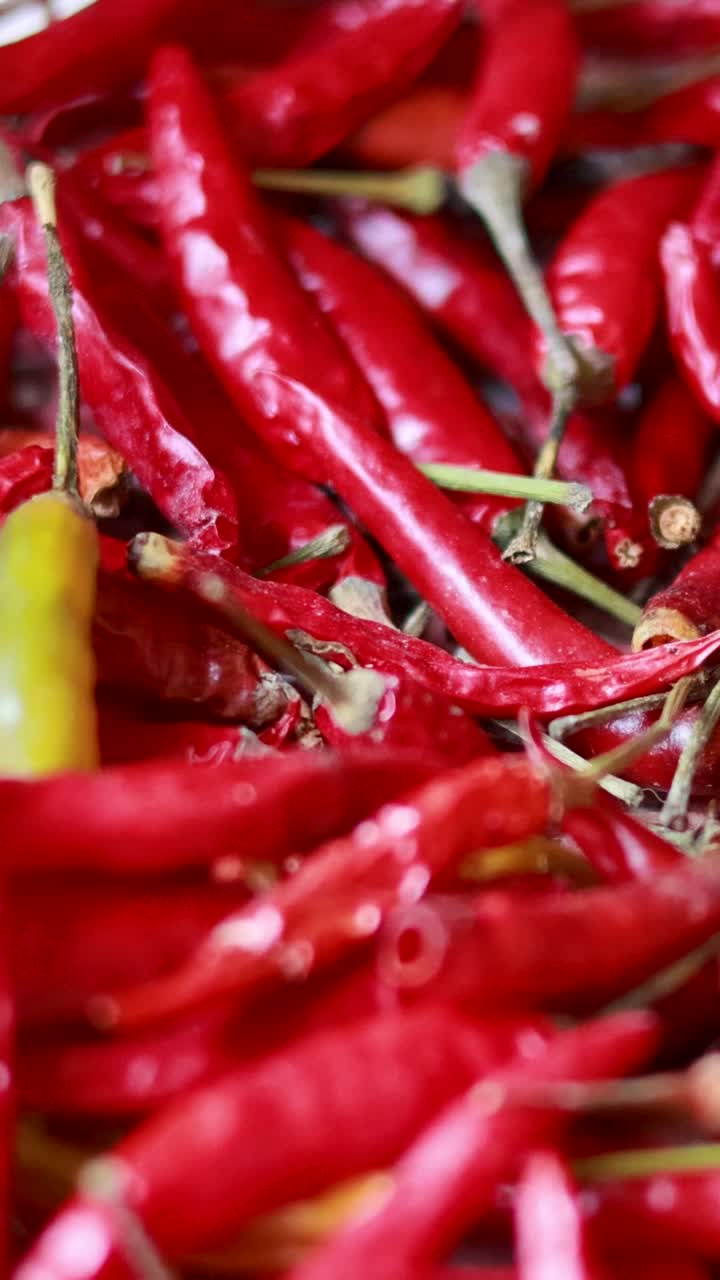 Close-up of dried red chillis in Thai floating market basket