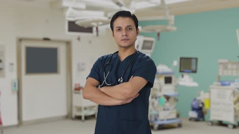 Portrait-of-confident-Indian-doctor-standing-crossed-hands