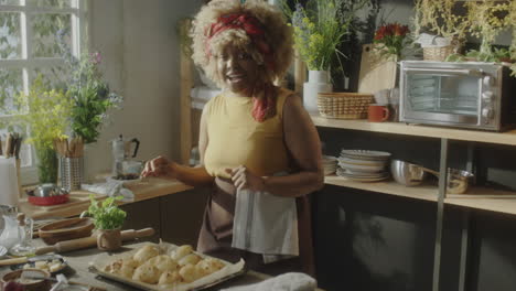 woman baking fresh pastries in a bright kitchen