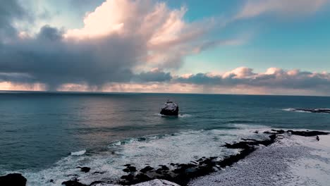 karlinn seacliff off the coast of valahnukur on a dramatic winter sunset in reykjanes peninsula, iceland