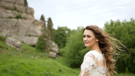 Beautiful Bride Fashion Portrait in Wedding Luxury Dress Beautiful Bride Fashion Portrait in Wedding Luxury Dress with Lace and Crystals at Arabian Style Interior Brunette Happy Woman Wears Bridal White Dress with Wedding Makeup and Hairstyle Newlywed High Quality Photo