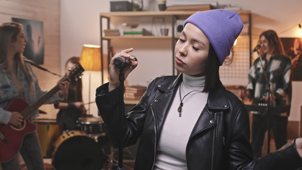 Fancy Young Woman Performing Rock Music With Band