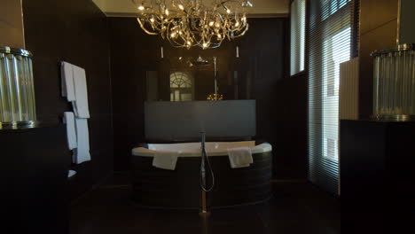 Dolly-in-towards-luxurious-bubble-bath-in-bath-room