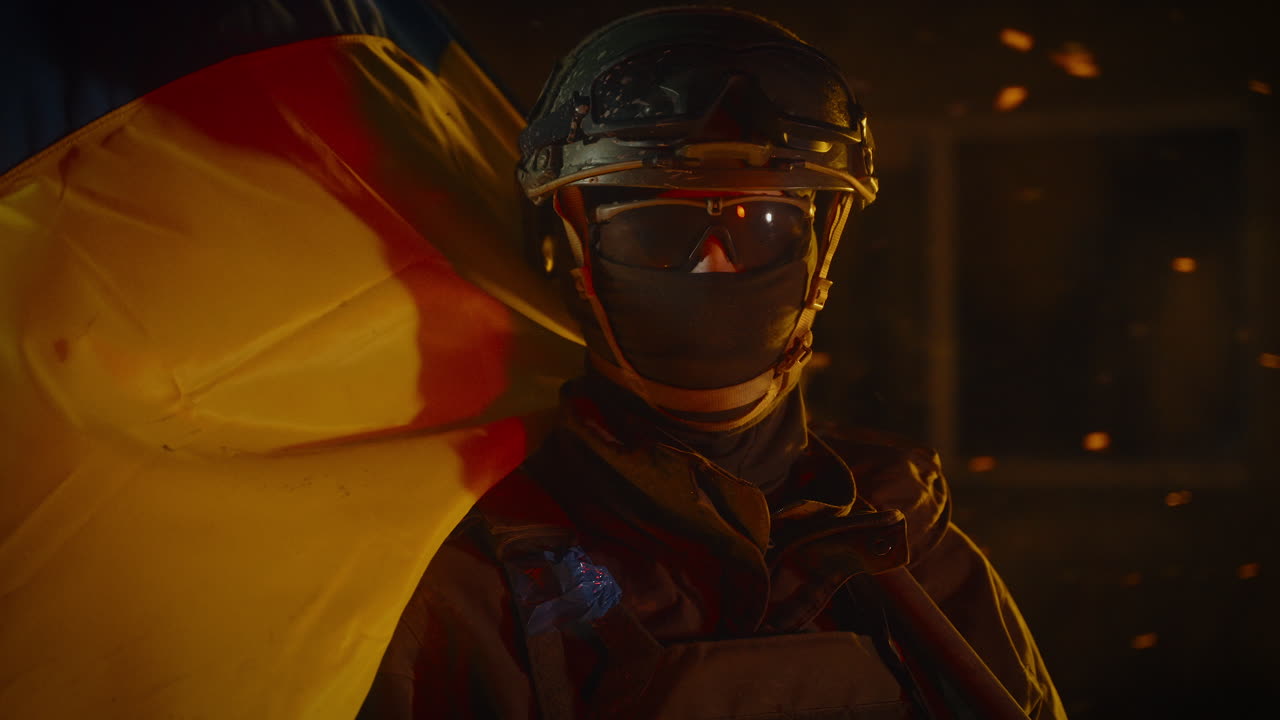 Ukrainian soldier with flag in a night setting