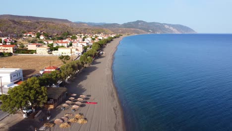 Longest and secluded Greek island Vatera beach beautiful landscape surrounding the sea and mountains, Lesvos Island, Revealing drone view