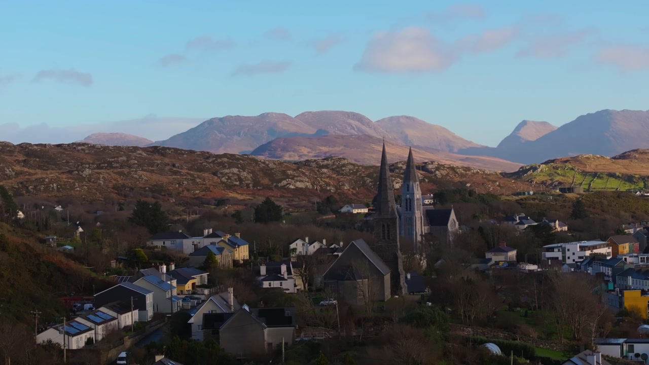 4K Aerial drone footage of St Joseph’s Church and Christ Church Clifden with Connemara Mountains Background_06