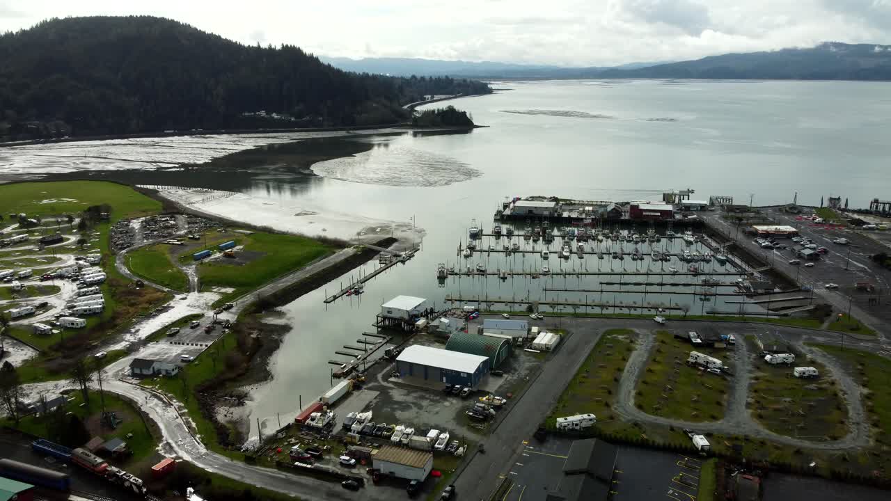US, Oregon, Garabaldi, , 2025-03-18 - Drone view of the marina and Nehalem Bay in winter.