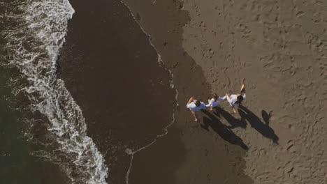 family walking on the beach