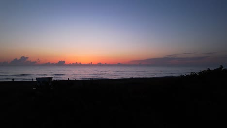 florida-beach-sunrise-aerial-fly-past-palm-tree