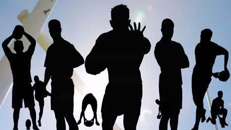 Animation-of-silhouettes-of-male-rugby-players-over-stadium