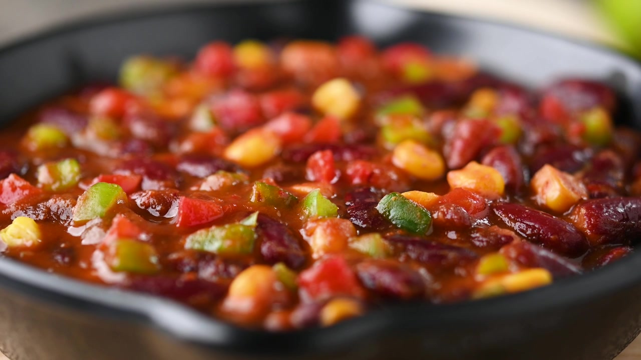 Feijões mexicanos com chilli e legumes