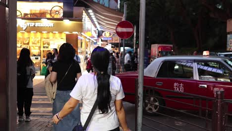 people walking and interacting on busy street