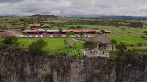 aerial drone shot of a swing in a canyon