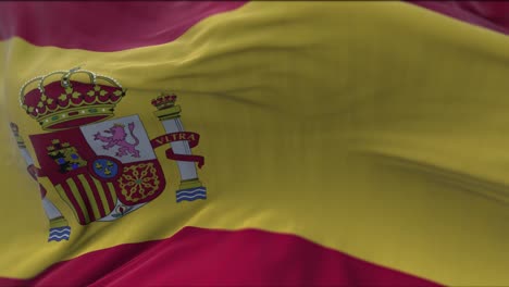 close up view of the spanish national flag waving in the wind