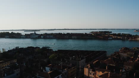 Aerial view panning from the Chiesa del Santissimo Redentore to the Basilica di Santa Maria della Salute in Venice, Italy