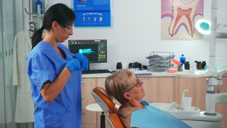 nurse preparing patient arranging dental bib