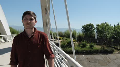 young boy crossing bridge