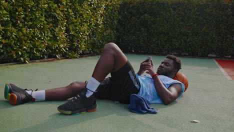 basketball player resting on the court