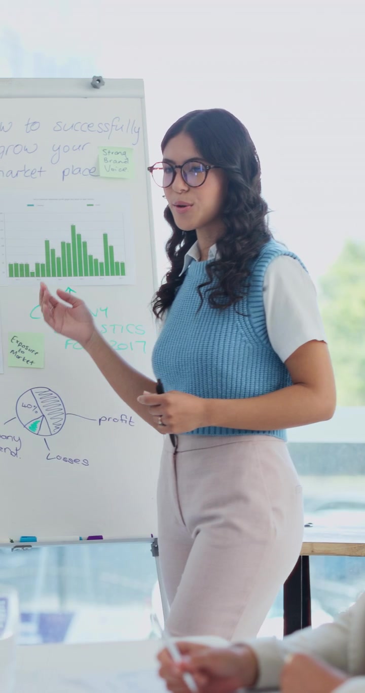 Young Businesswoman Giving a Presentation in a Modern Office