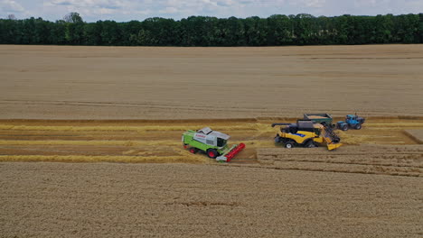combine harvester at work in field. agricultural combine harvesters working on rural field