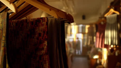 clothing on hangers in a boutique shop