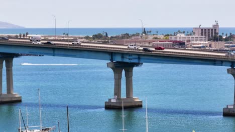 zoomed in view of coronado bridge rising above to reveal imperial beach and mexico