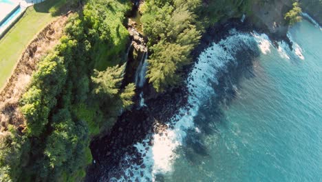 FPV-drone-follow-up-shot-of-a-tourist-golfer-playing-golf-on-the-Big-Island-in-Hawaii-surrounded-by-lush-green-foliage-and-greenery-and-leading-to-the-Pacific-Ocean-4K-UHD