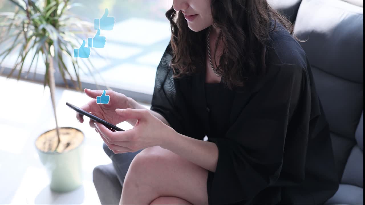 Woman using smartphone with social media likes