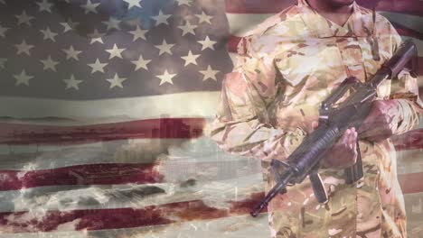 animation of african american male soldier holding assault rifle over american flag, city and sky