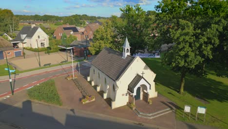 orbit drone shot of cornelius chapel in brabant rural dutch village gastel