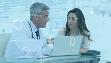 animation of data processing over diverse doctors using laptop